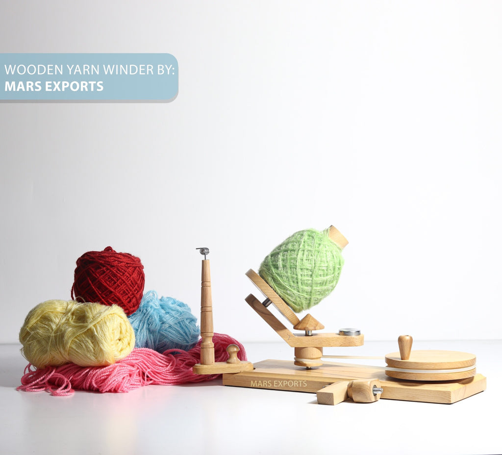 Clamp-mounted beechwood yarn winder in a knitting and crochet workspace