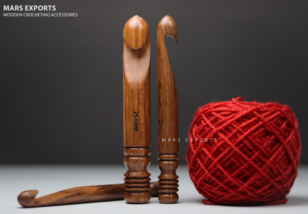 15 mm, 20 mm and 25 mm rosewood crochet hooks shown with red yarn