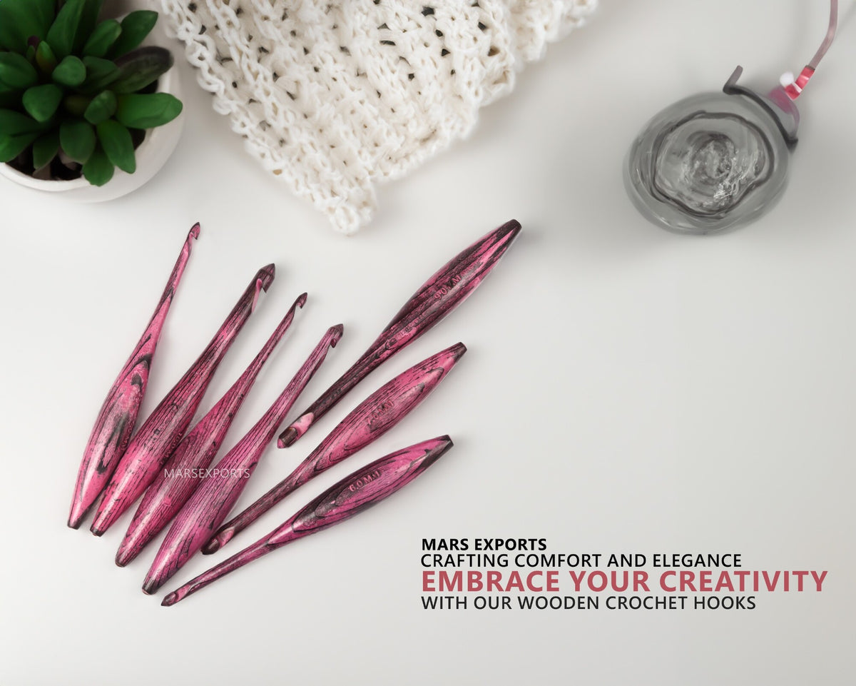 Antique red wooden dolphin crochet hooks in a yarn-crafting lifestyle scene