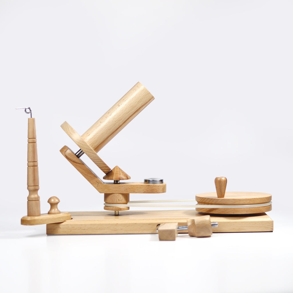 Handcrafted beechwood yarn winder on white background