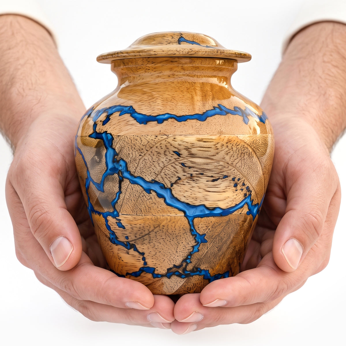 Handcrafted small wooden urn with distinctive blue resin pattern